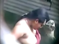 Secretly recorded MMS of a village aunty taking a bath captured by a voyeur - Play Indian Porn